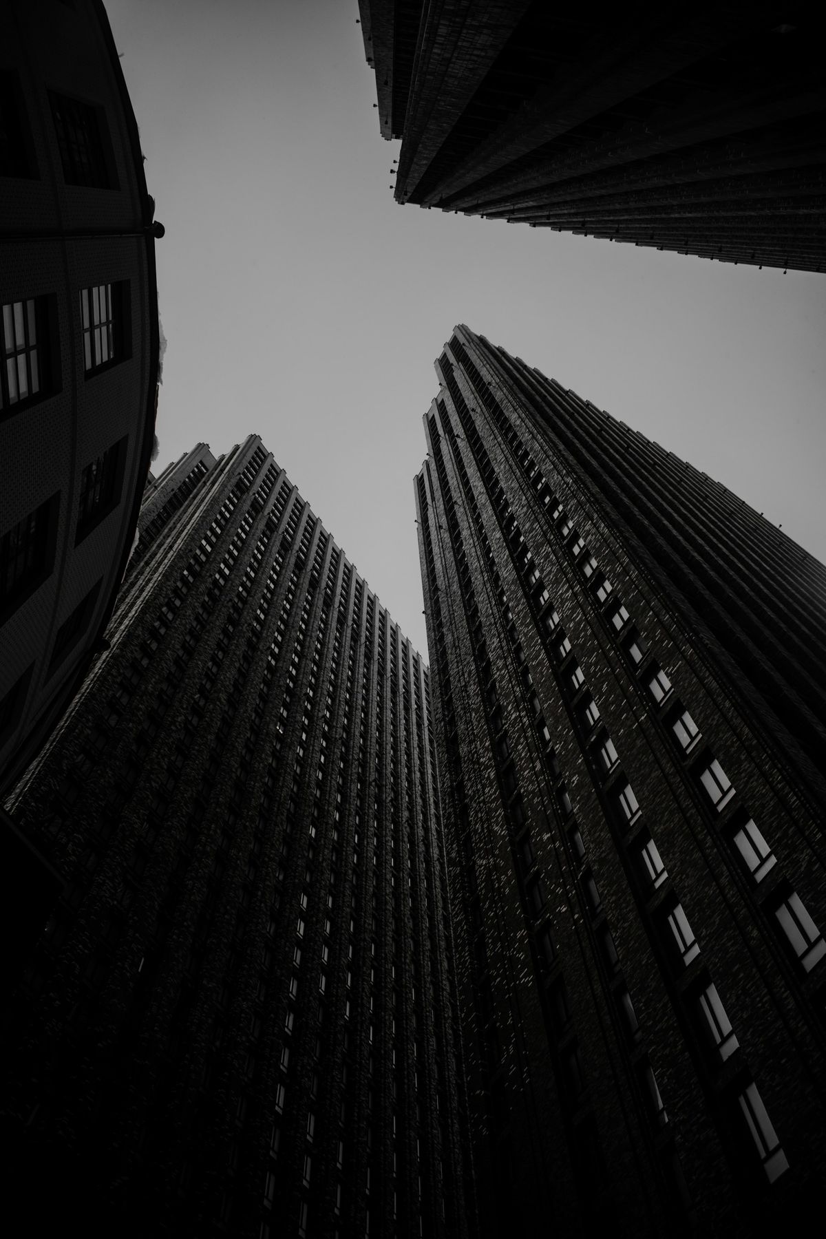Looking up between two dark towers